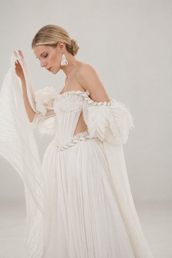 Celestial ivory silk wedding dress by Rara Avis, puff sleeves and pleated corset