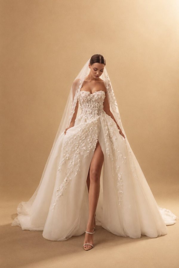 Dahlia wedding dress by Ricca Sposa, 3D flowers on the corset and a high slit skirt