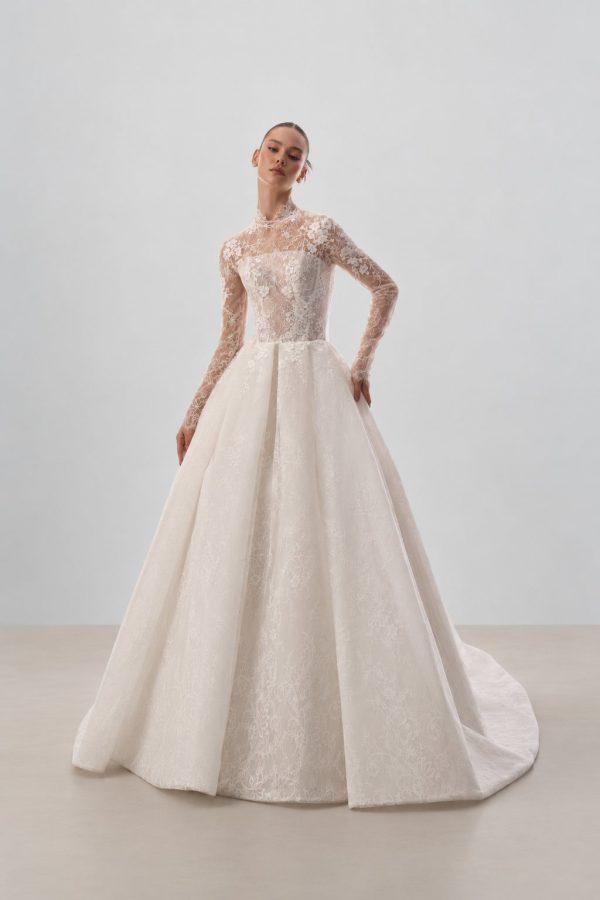 Evie wedding dress by Innocentia with a high neck, long lace sleeves and an A-line skirt
