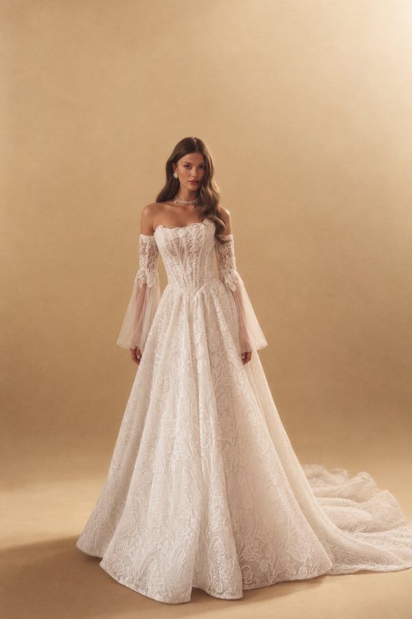 Kitty floral guipure wedding dress by Katy Corso, strapless bodice and sheer sleeves